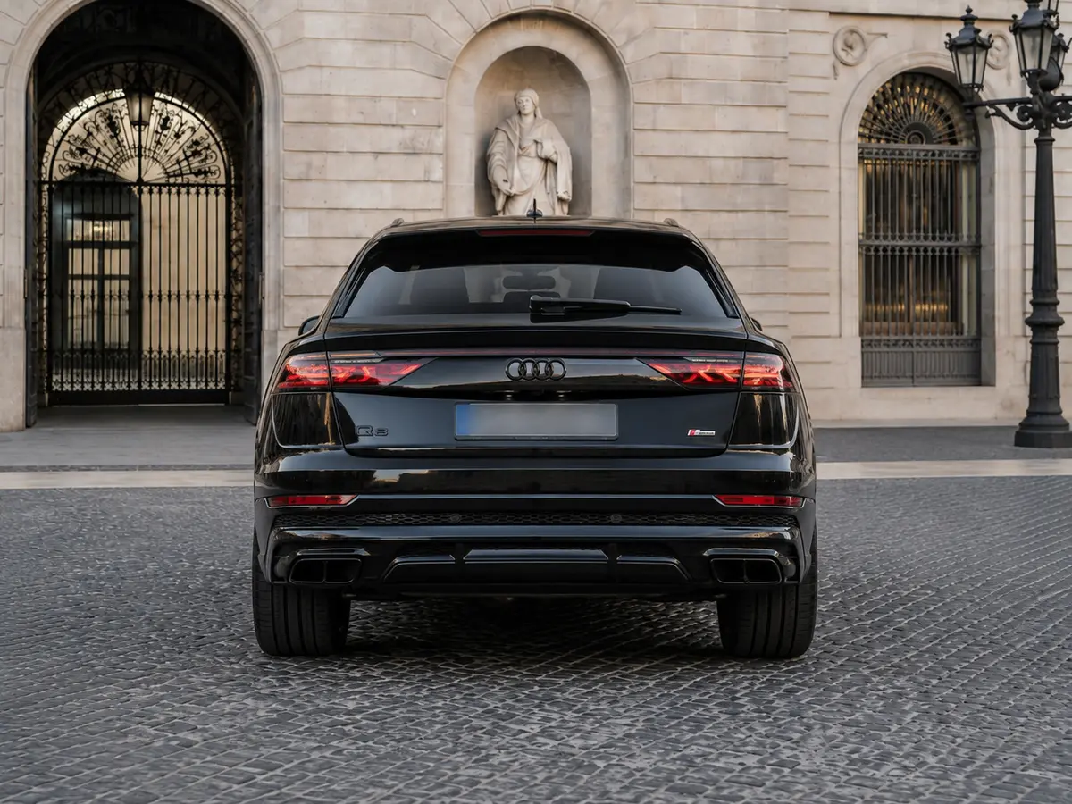 Audi Q8 2025, rear view — Lisbon Luxury Car Rental, Lisbon. The 2025 Audi Q8 carries its 340 hp with the kind of composure that suits a full-size SUV…