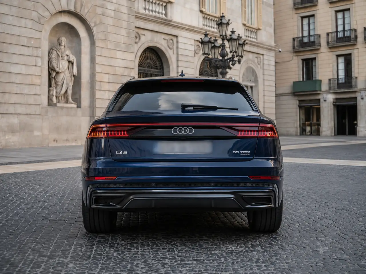 Audi Q8 55 TFSI 2022, rear view — Lisbon Luxury Car Rental, Lisbon. The Audi Q8 55 TFSI brings a composed, substantial character to the road: 340 hp routed…