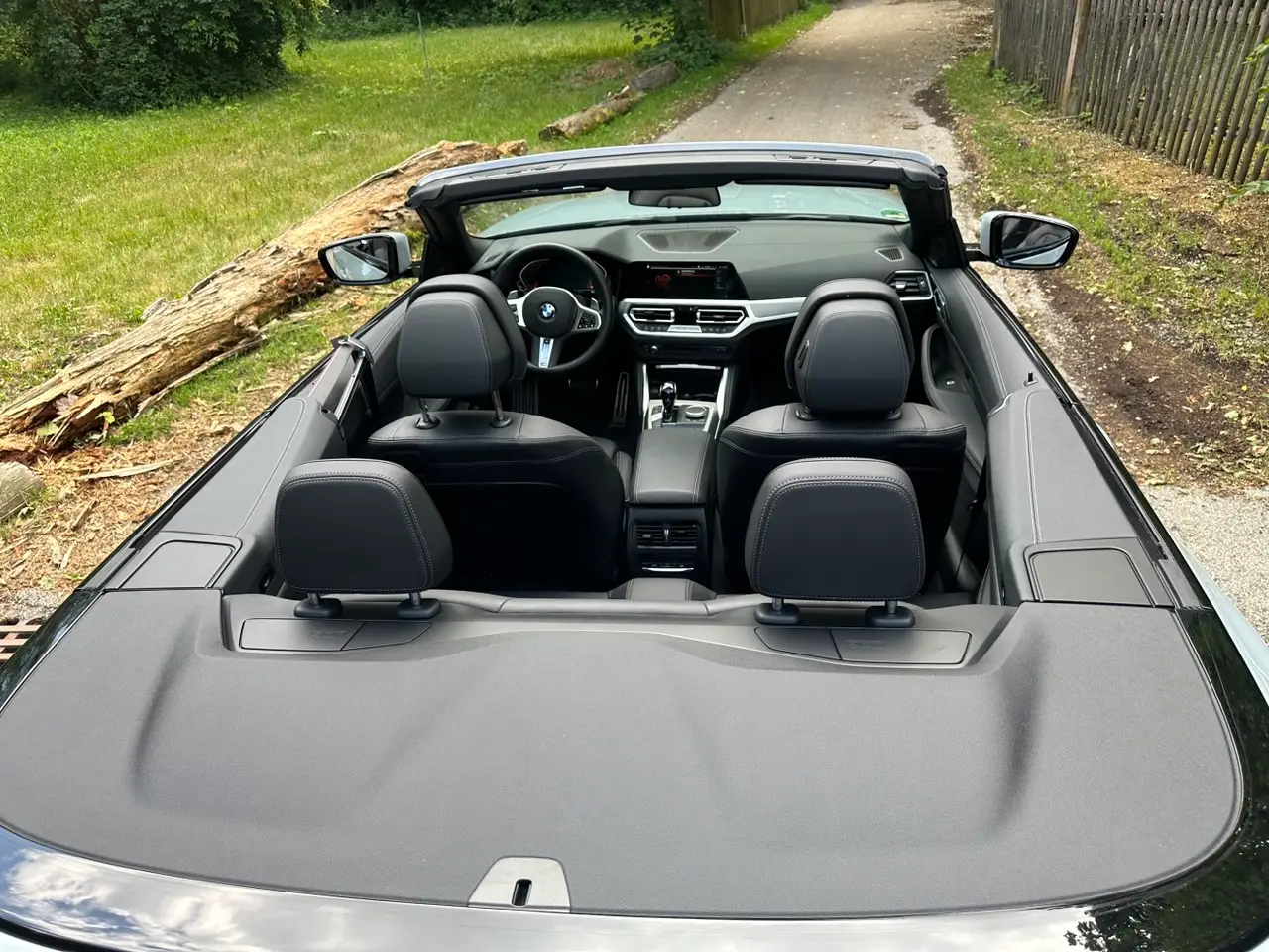 BMW 430i Cabrio 2023, rear view — Lisbon Luxury Car Rental, Lisbon. The BMW 430i Cabrio pairs a 245 hp turbocharged engine with a soft-top roof that lowers…