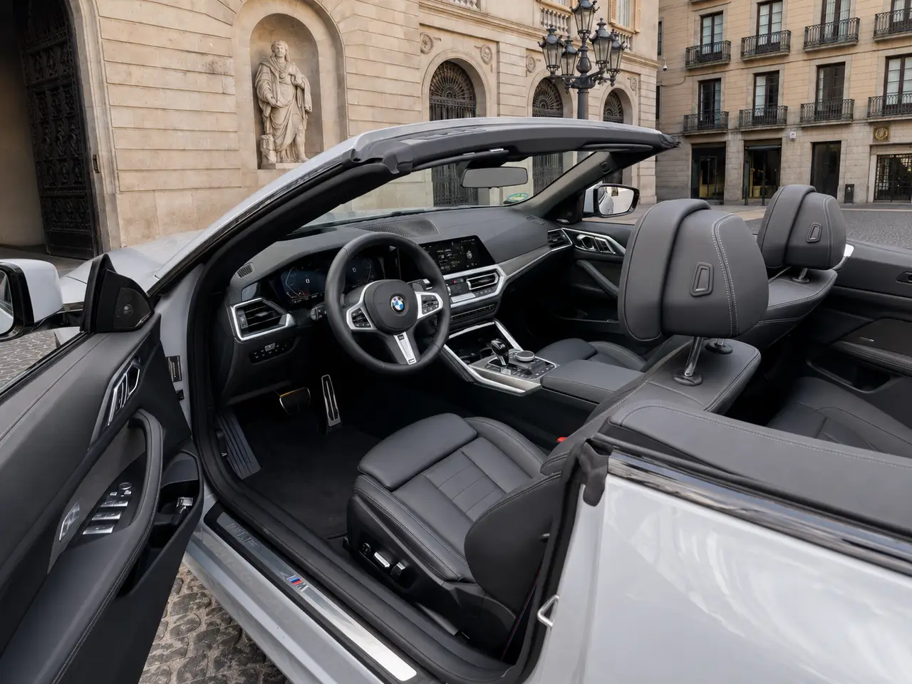 BMW 430i Cabrio 2023, rear view — Lisbon Luxury Car Rental, Lisbon. The BMW 430i Cabrio pairs a 245 hp turbocharged engine with a soft-top roof that lowers…