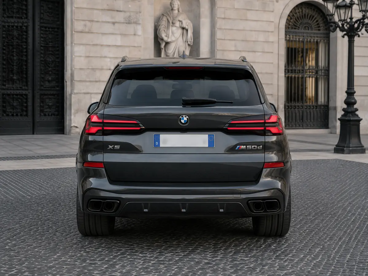 BMW X5 M-pack 30d 2025, rear view — Lisbon Luxury Car Rental, Lisbon. The BMW X5 M-pack 30d pairs diesel torque with the composure BMW's M suspension tuning is…