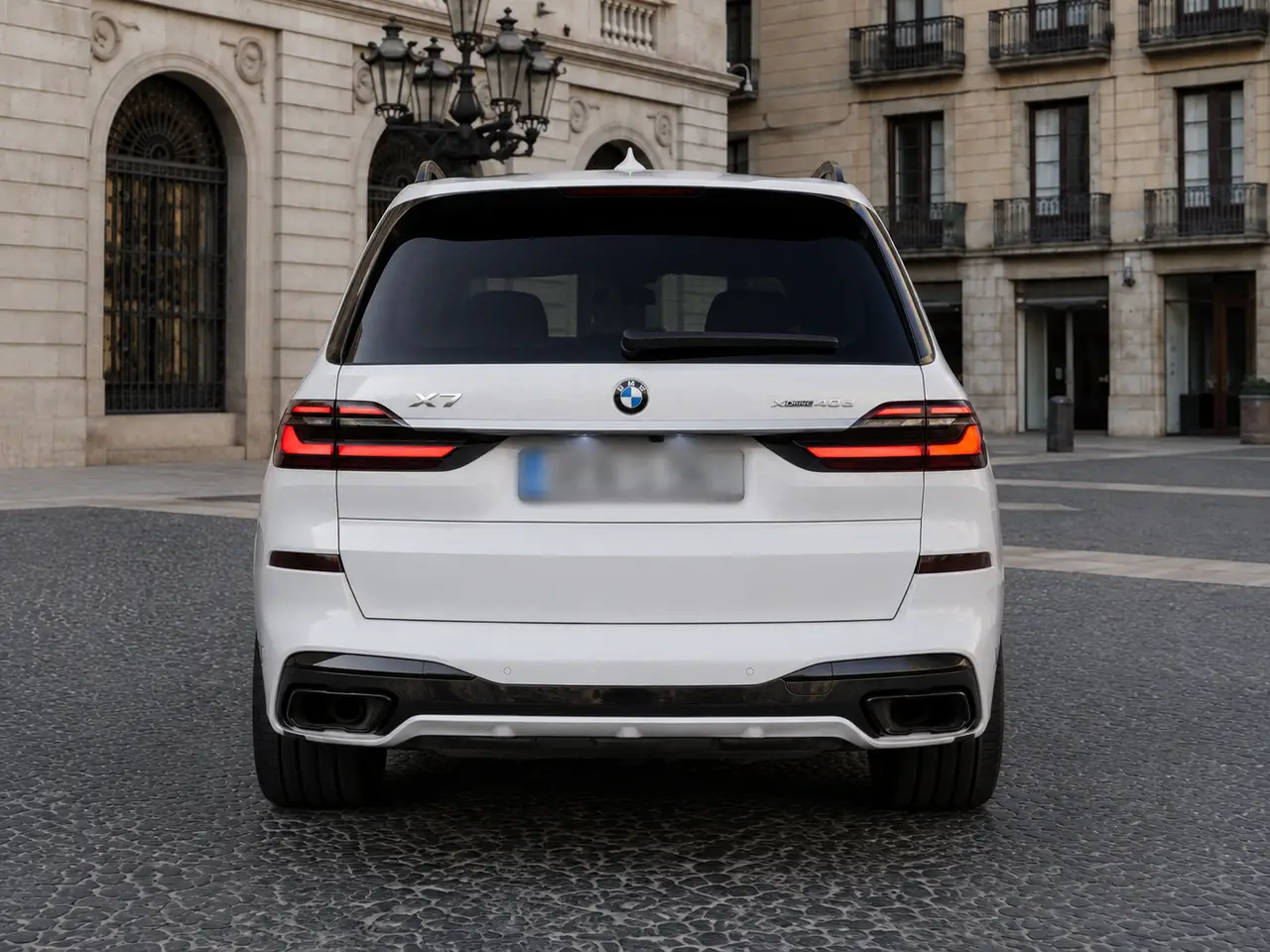 BMW X7 40d M 2024, rear view — Lisbon Luxury Car Rental, Lisbon. The 2024 BMW X7 40d M brings a rare combination to Lisbon's roads: seven seats, 352 hp,…
