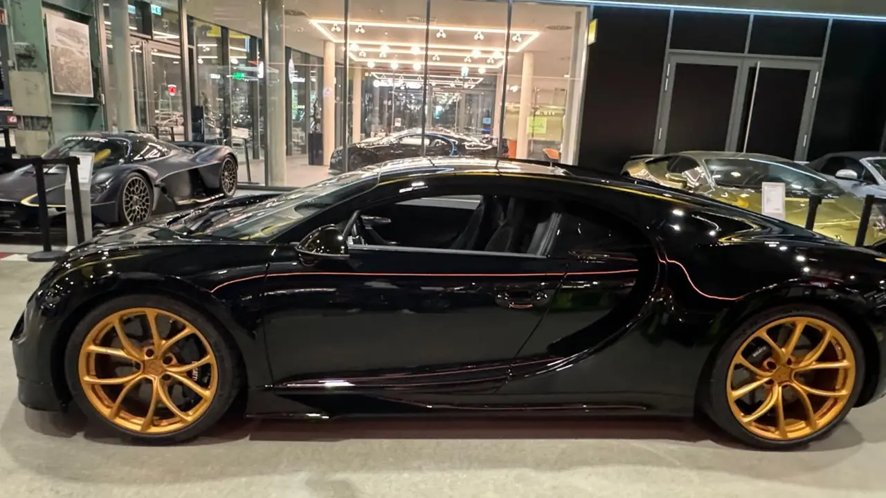 Bugatti Chiron 110 Ani 2019, side profile — Lisbon Luxury Car Rental, Lisbon. The Bugatti Chiron 110 Ani is a limited anniversary build marking Bugatti's 110th year,…