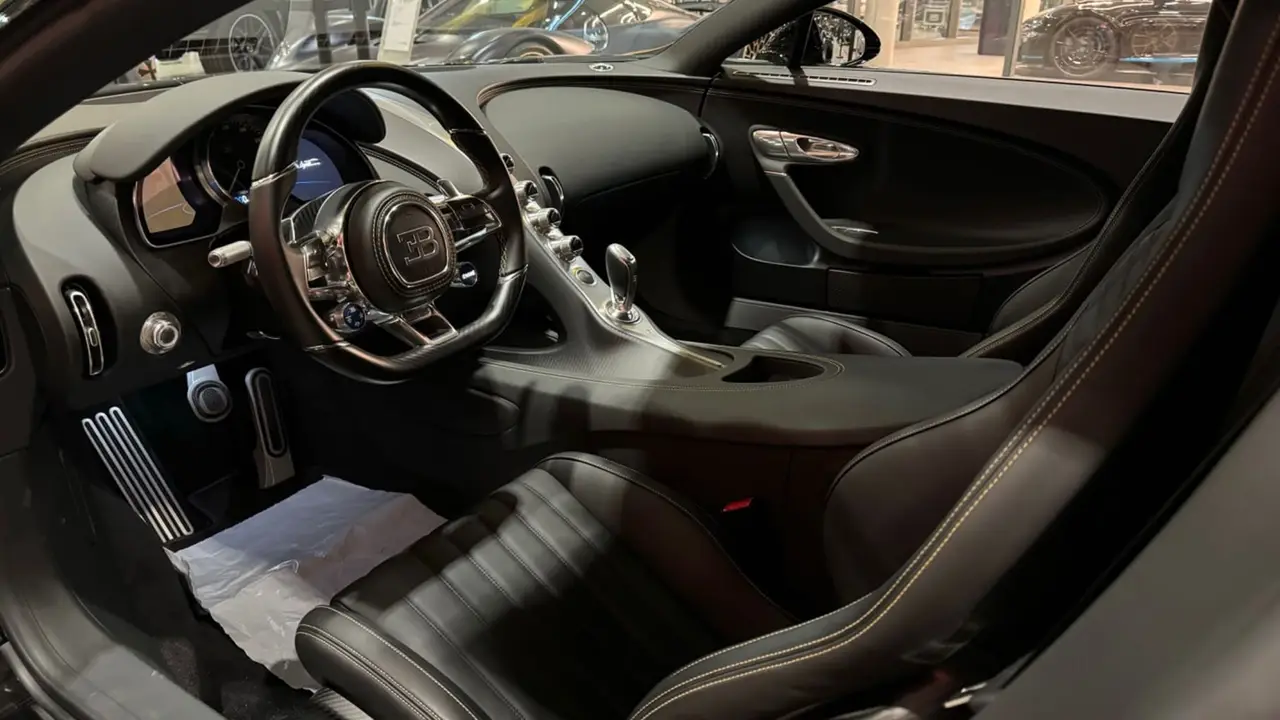 Bugatti Chiron 110 Ani 2019, rear view — Lisbon Luxury Car Rental, Lisbon. The Bugatti Chiron 110 Ani is a limited anniversary build marking Bugatti's 110th year,…