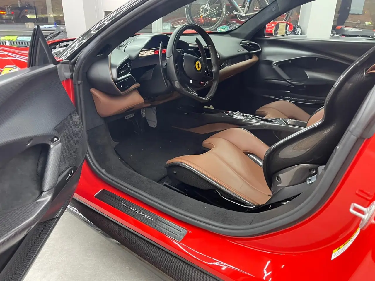 Ferrari 296 GTB 2023, exterior — Lisbon Luxury Car Rental, Lisbon. The 296 GTB pairs a twin-turbo V6 with hybrid assistance to reach 830 hp, delivered…
