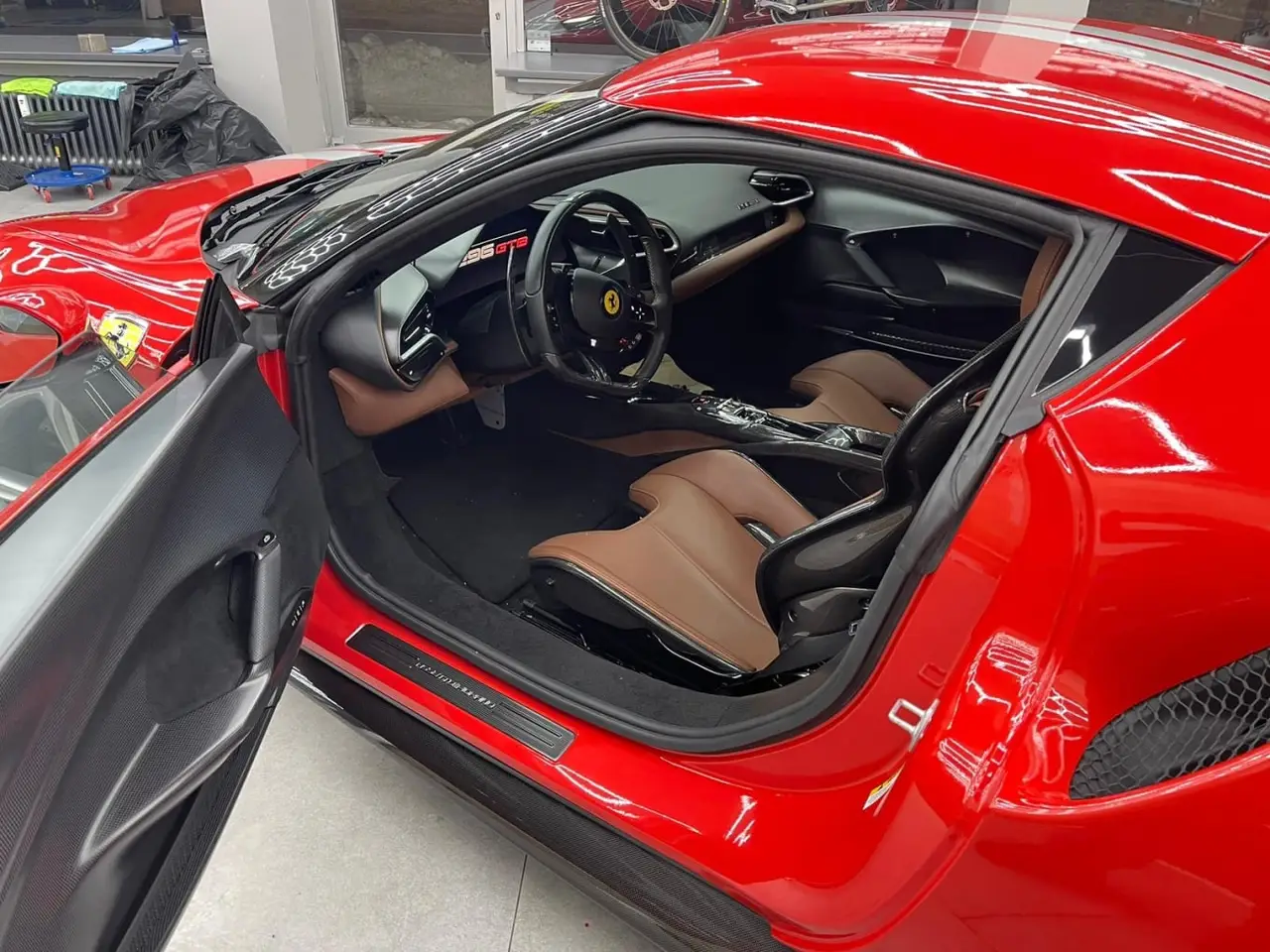 Ferrari 296 GTB 2023, front view — Lisbon Luxury Car Rental, Lisbon. The 296 GTB pairs a twin-turbo V6 with hybrid assistance to reach 830 hp, delivered…
