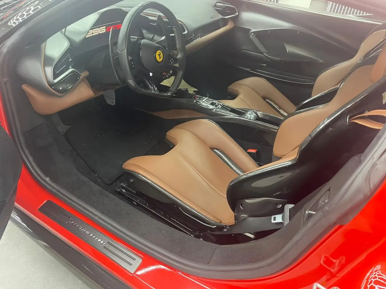 Ferrari 296 GTB 2023, dashboard — Lisbon Luxury Car Rental, Lisbon. The 296 GTB pairs a twin-turbo V6 with hybrid assistance to reach 830 hp, delivered…