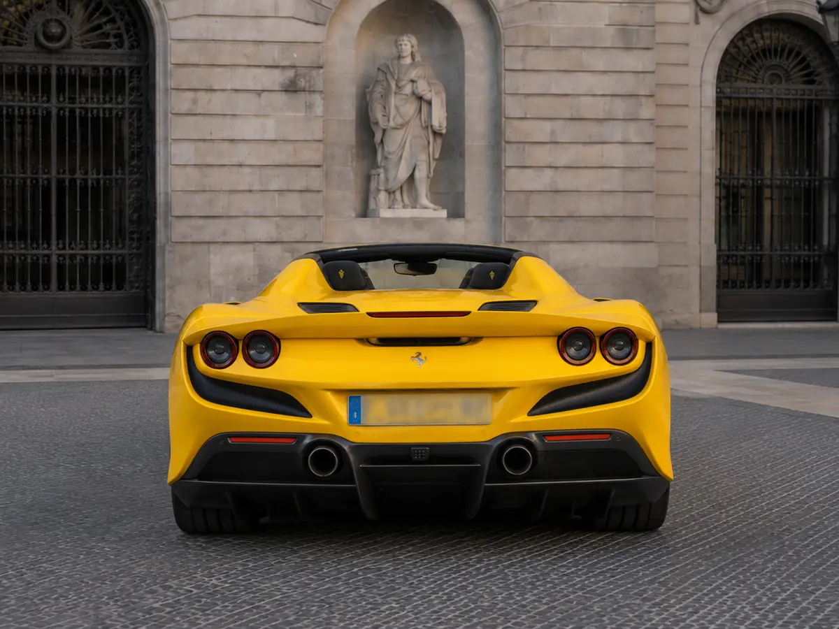 Ferrari F8 SPIDER 2023, rear view — Lisbon Luxury Car Rental, Lisbon. The Ferrari F8 Spider pairs a 720 hp twin-turbo V8 with a retractable hard top, giving it…