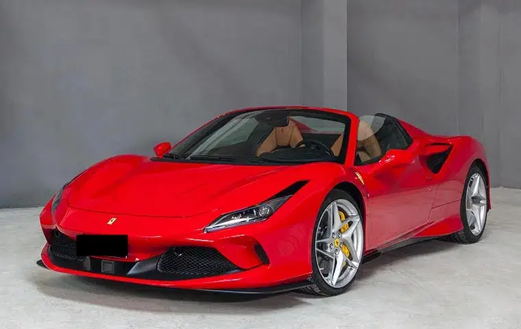 Ferrari F8 Tributo Spider Red 2023, front view — Lisbon Luxury Car Rental, Lisbon. The Ferrari F8 Tributo Spider pairs a 720 hp twin-turbo V8 with a retractable hard top,…