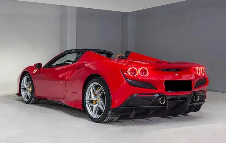 Ferrari F8 Tributo Spider Red 2023, interior — Lisbon Luxury Car Rental, Lisbon. The Ferrari F8 Tributo Spider pairs a 720 hp twin-turbo V8 with a retractable hard top,…