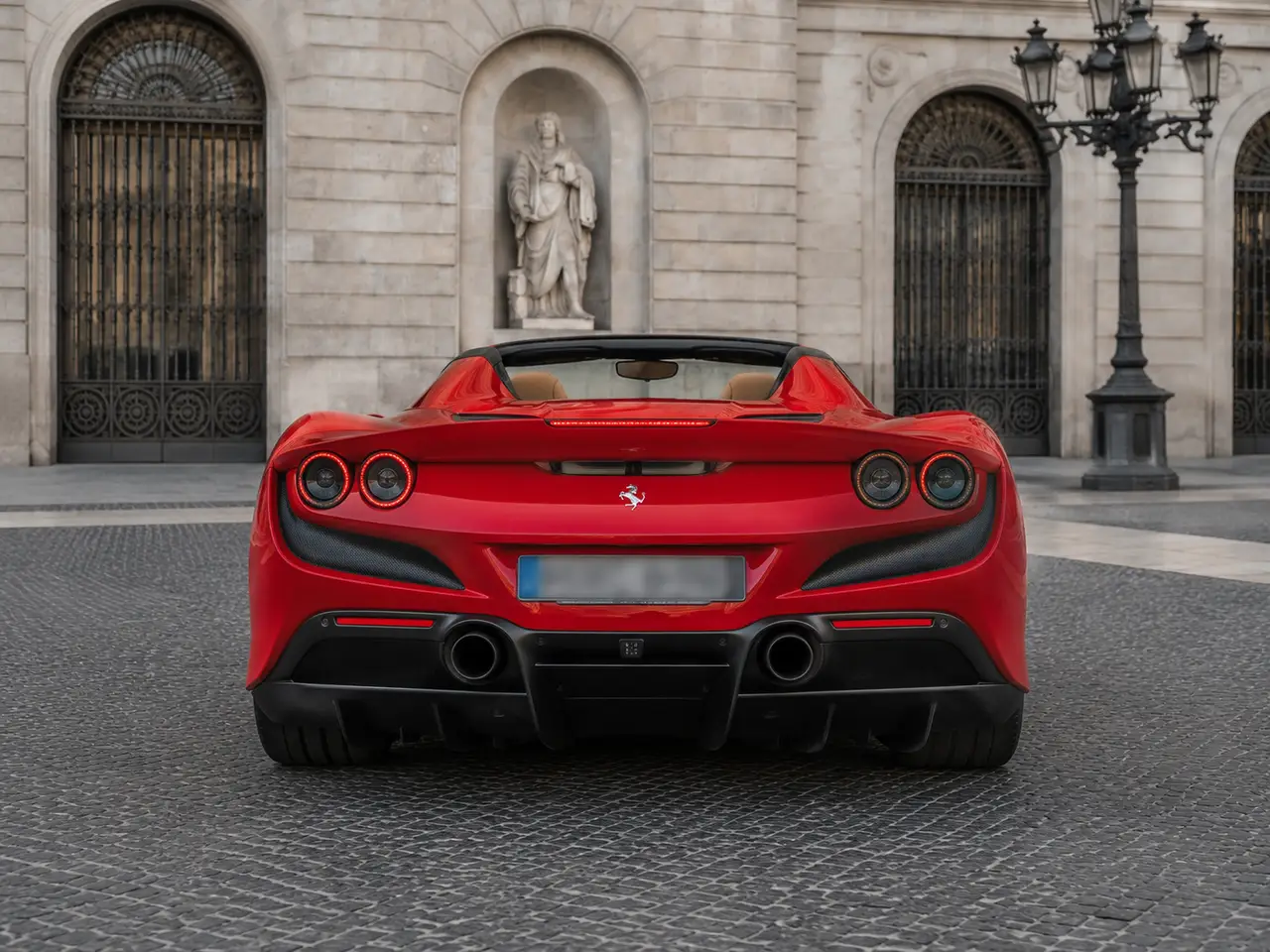 Ferrari F8 Tributo Spider Red 2023, rear view — Lisbon Luxury Car Rental, Lisbon. The Ferrari F8 Tributo Spider pairs a 720 hp twin-turbo V8 with a retractable hard top,…