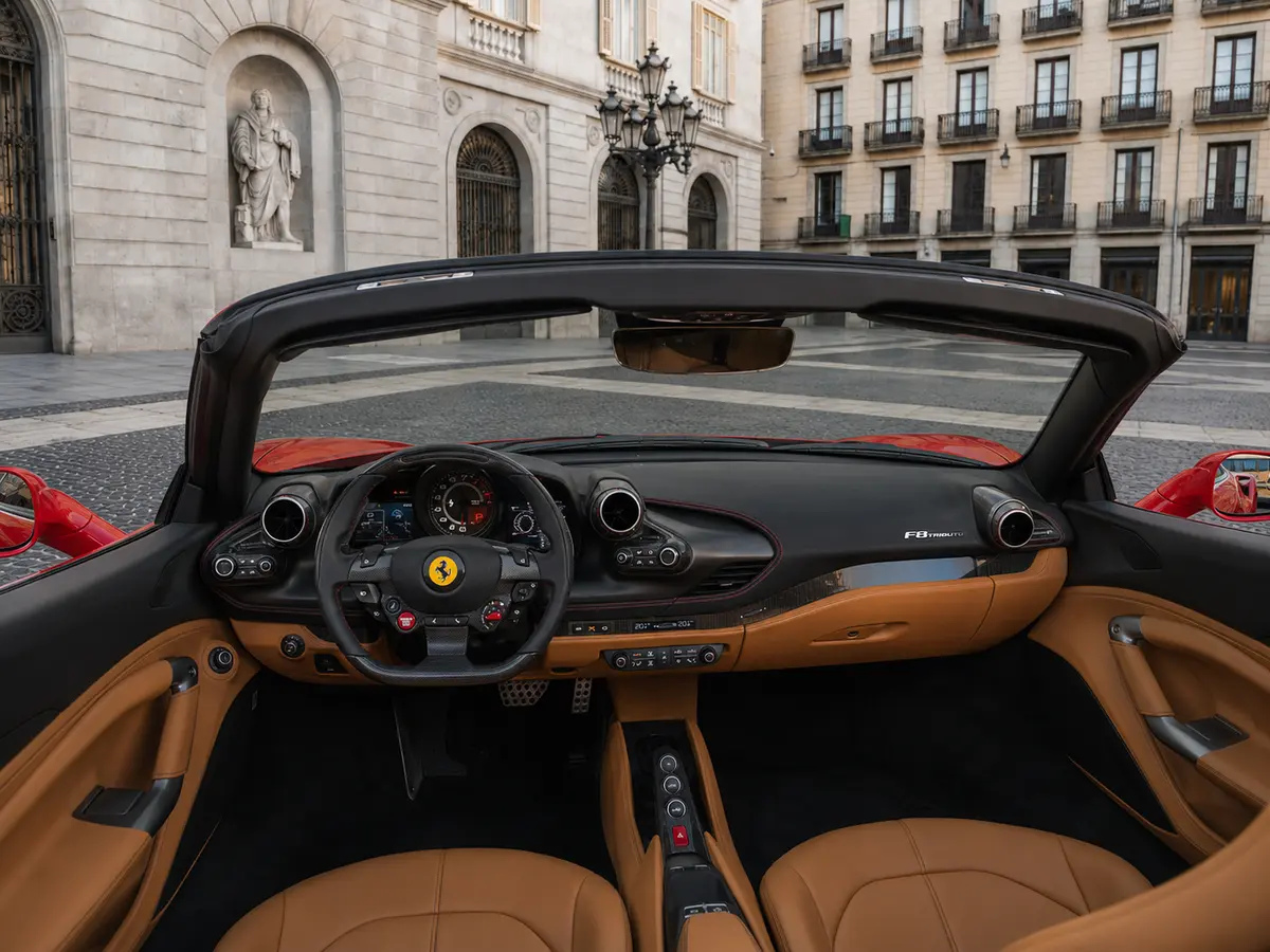 Ferrari F8 Tributo Spider Red 2023, interior — Lisbon Luxury Car Rental, Lisbon. The Ferrari F8 Tributo Spider pairs a 720 hp twin-turbo V8 with a retractable hard top,…