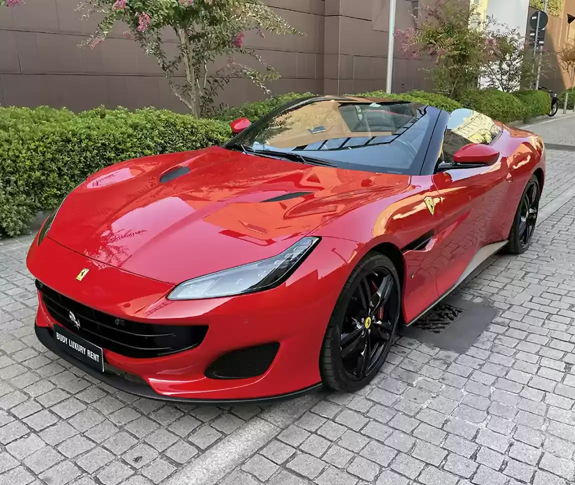 Ferrari Portofino M 2023, rear view — Lisbon Luxury Car Rental, Lisbon. The Portofino M carries 620 hp and four seats under a folding hard top, which sets it…