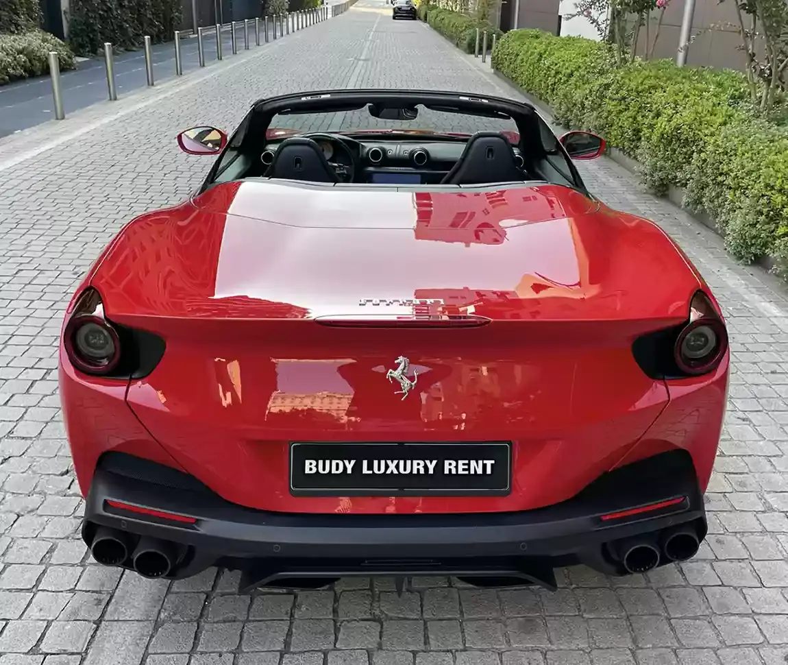 Ferrari Portofino M 2023, side profile — Lisbon Luxury Car Rental, Lisbon. The Portofino M carries 620 hp and four seats under a folding hard top, which sets it…