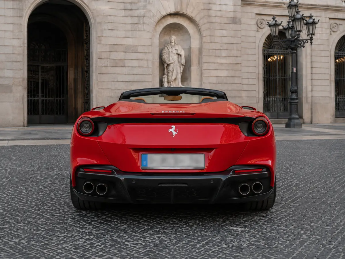 Ferrari Portofino M 2023, rear view — Lisbon Luxury Car Rental, Lisbon. The Portofino M carries 620 hp and four seats under a folding hard top, which sets it…