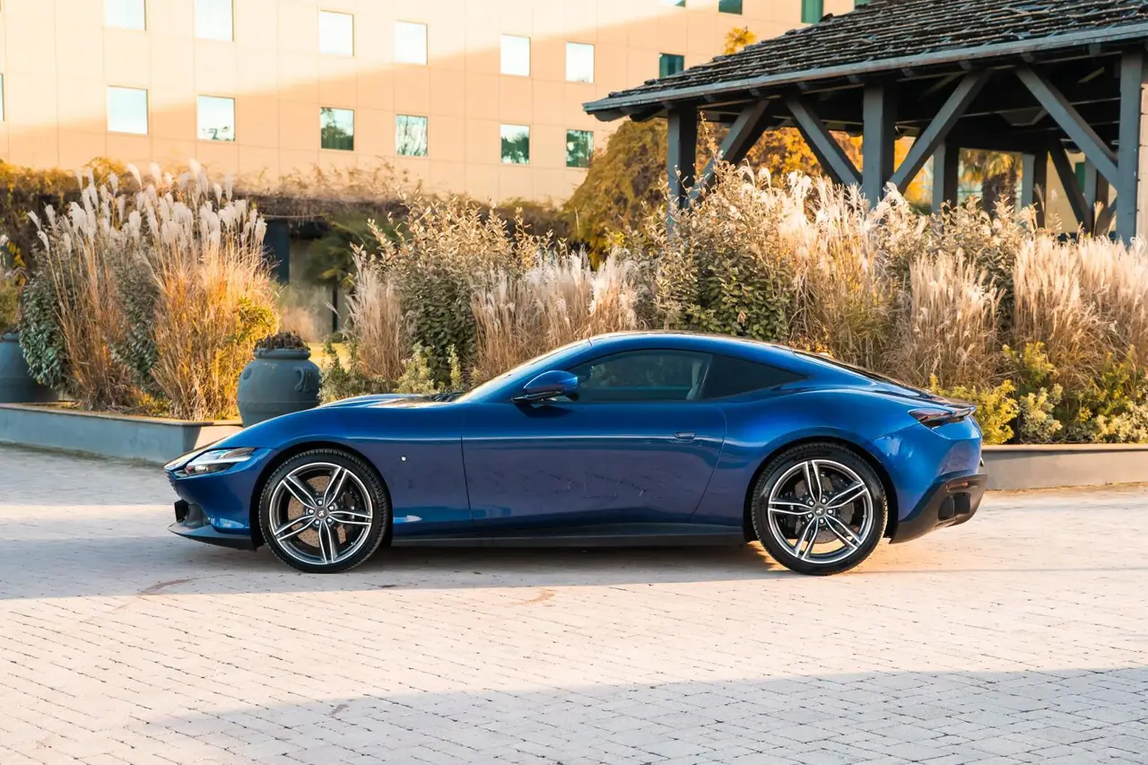 Ferrari Roma 2025, rear view — Lisbon Luxury Car Rental, Lisbon. The Ferrari Roma pairs a 620 hp V8 with a cabin built for two couples rather than two…