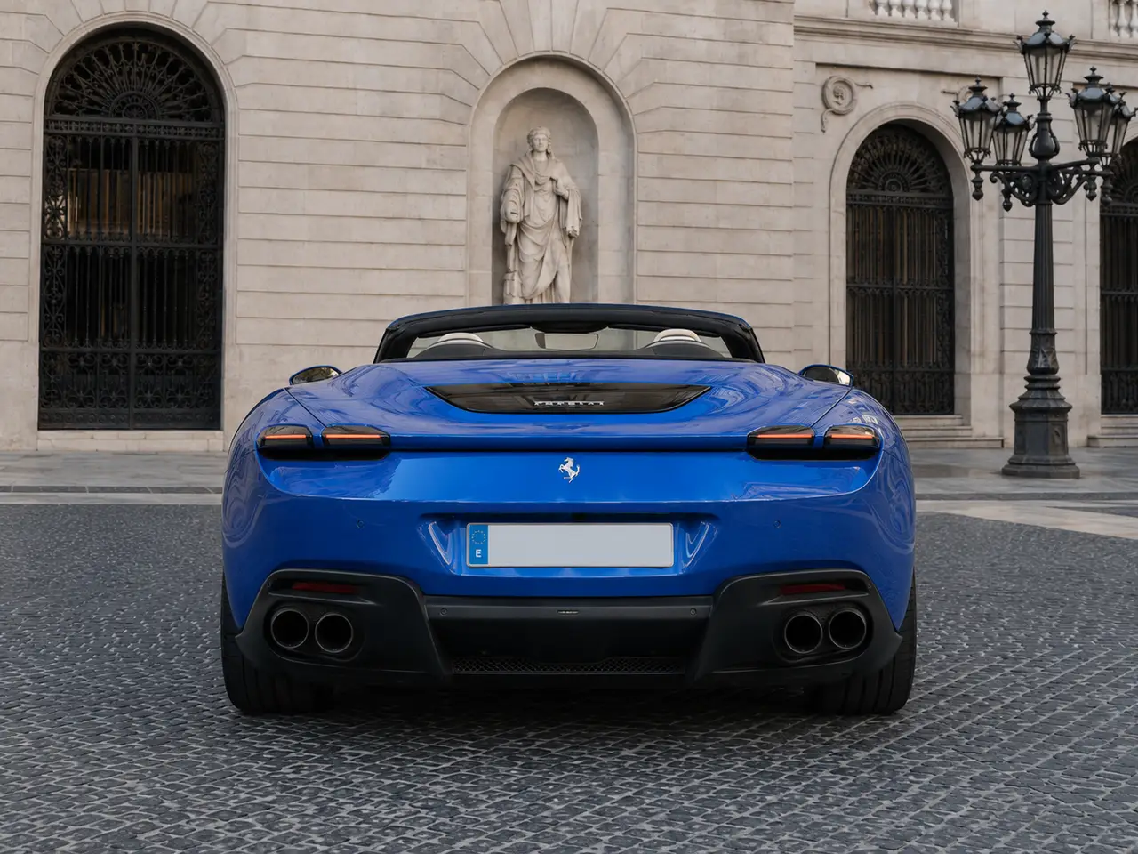 Ferrari Roma 2025, rear view — Lisbon Luxury Car Rental, Lisbon. The Ferrari Roma pairs a 620 hp V8 with a cabin built for two couples rather than two…