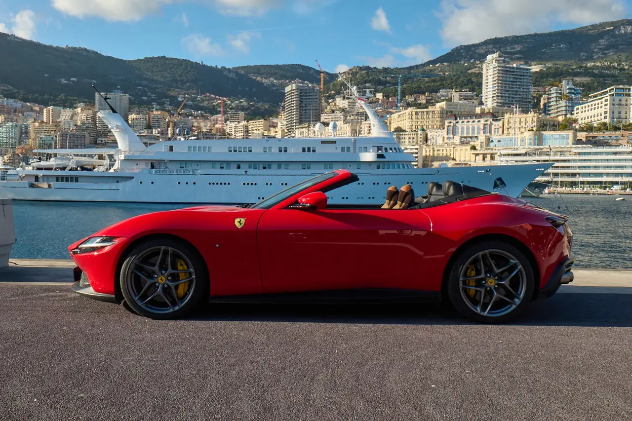 Ferrari Roma Spider 2024, exterior — Lisbon Luxury Car Rental, Lisbon. The 2024 Ferrari Roma Spider pairs 620 hp with a folding roof and a cabin built for two,…