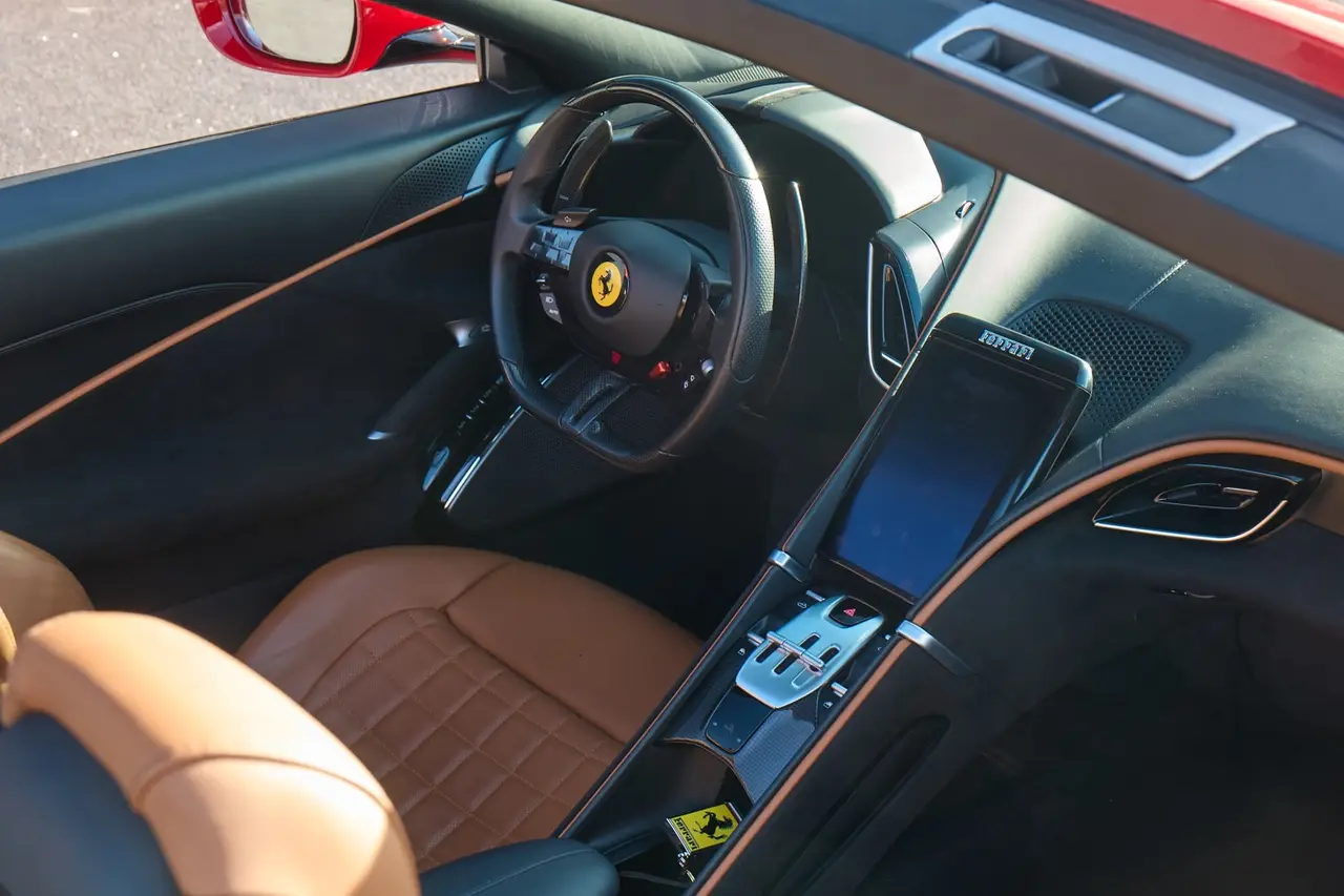 Ferrari Roma Spider 2024, rear view — Lisbon Luxury Car Rental, Lisbon. The 2024 Ferrari Roma Spider pairs 620 hp with a folding roof and a cabin built for two,…