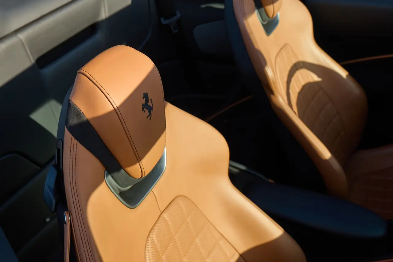 Ferrari Roma Spider 2024, interior — Lisbon Luxury Car Rental, Lisbon. The 2024 Ferrari Roma Spider pairs 620 hp with a folding roof and a cabin built for two,…