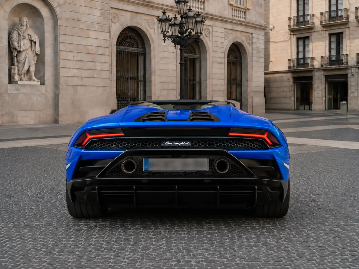 Lamborghini Huracan Evo Spyder 2022, rear view — Lisbon Luxury Car Rental, Lisbon. The Lamborghini Huracan Evo Spyder pairs a naturally aspirated V10 with 640 hp and the…