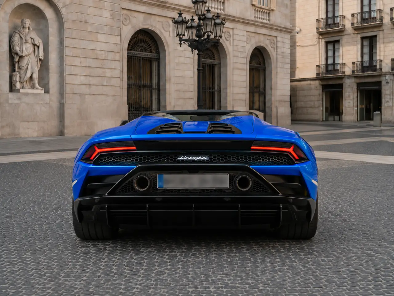 Lamborghini Huracan Evo Spyder 2022, rear view — Lisbon Luxury Car Rental, Lisbon. The Lamborghini Huracan Evo Spyder pairs a naturally aspirated V10 with 640 hp and the…