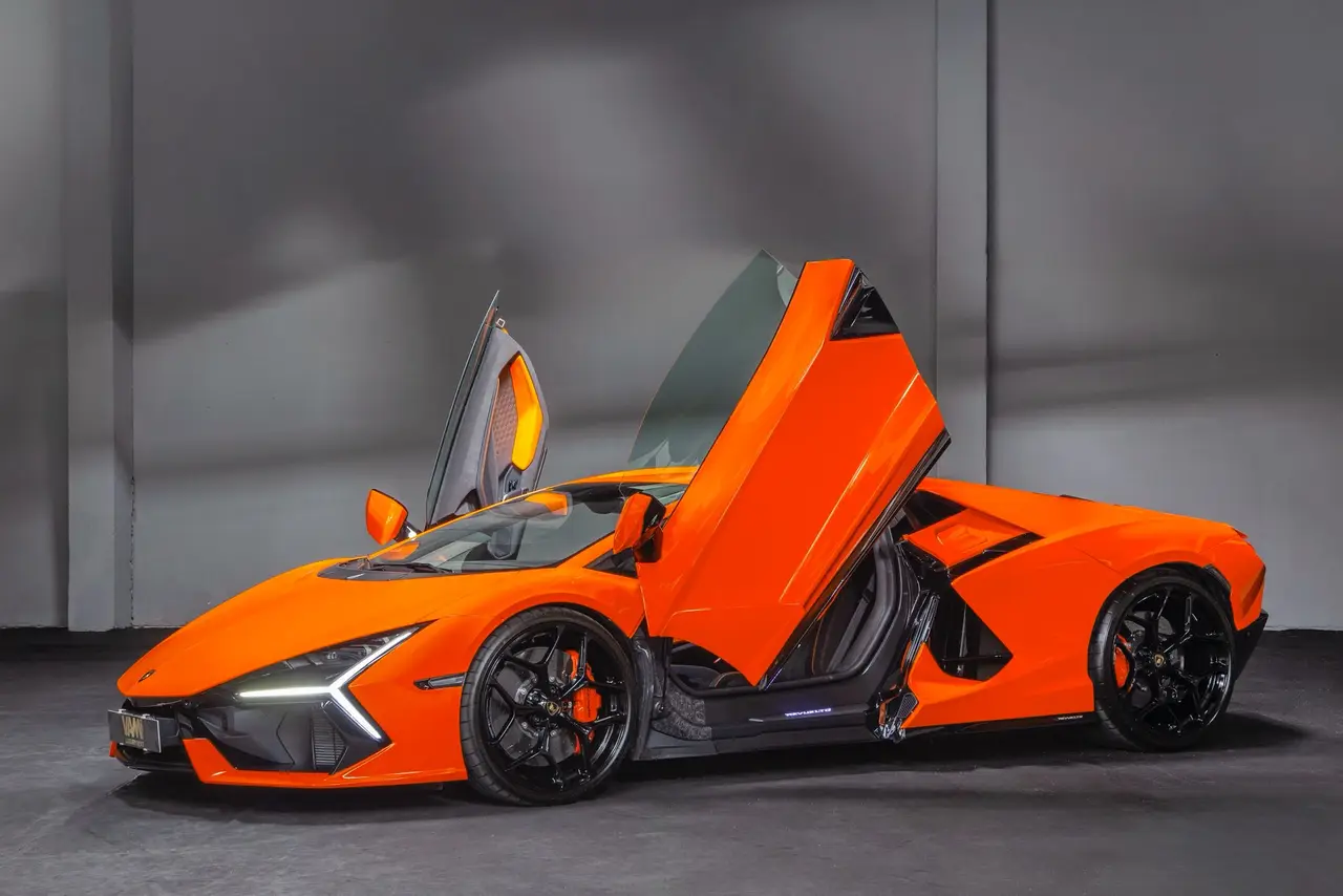 Lamborghini Revuelto 2026, exterior — Lisbon Luxury Car Rental, Lisbon. The Revuelto is Lamborghini's first series-production V12 hybrid, and it drives like an…