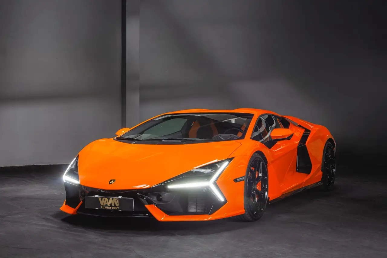 Lamborghini Revuelto 2026, front view — Lisbon Luxury Car Rental, Lisbon. The Revuelto is Lamborghini's first series-production V12 hybrid, and it drives like an…