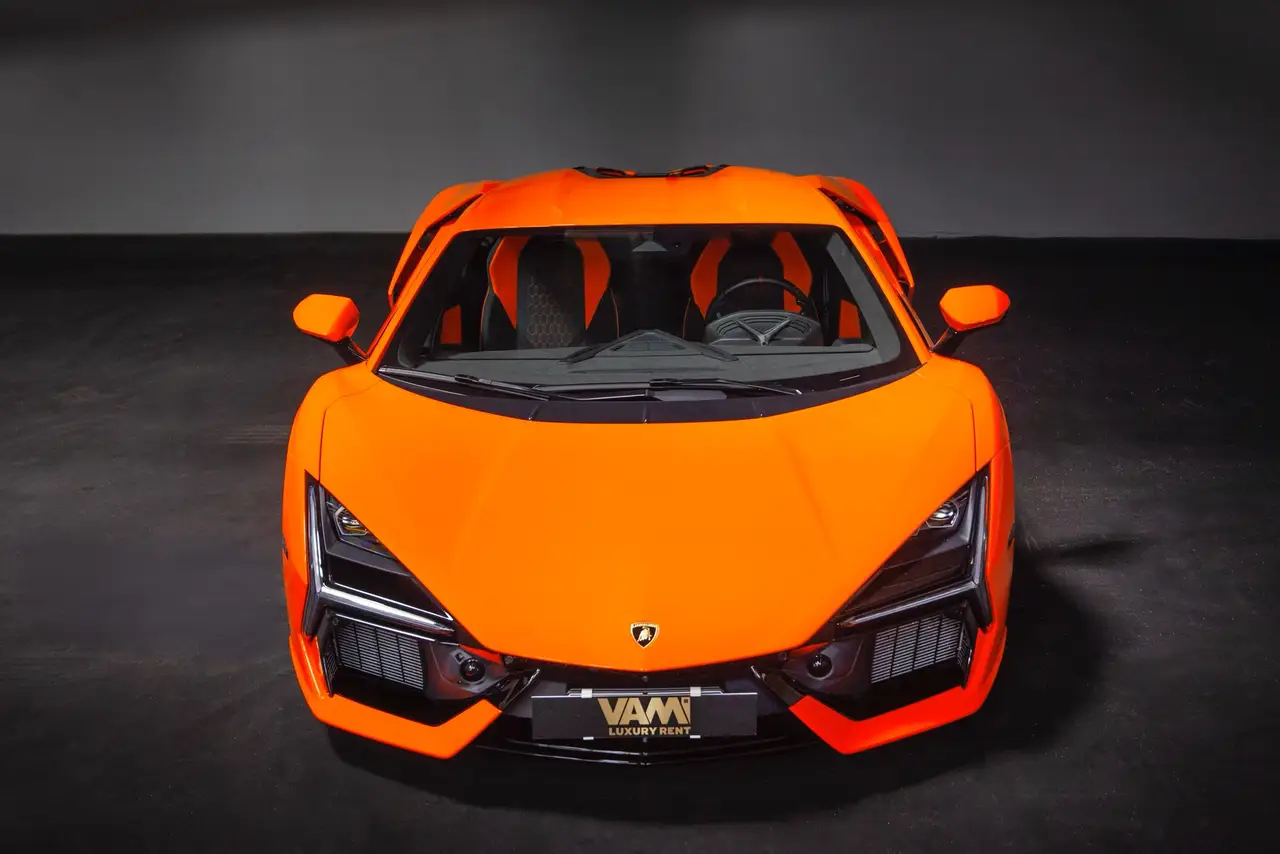 Lamborghini Revuelto 2026, rear view — Lisbon Luxury Car Rental, Lisbon. The Revuelto is Lamborghini's first series-production V12 hybrid, and it drives like an…