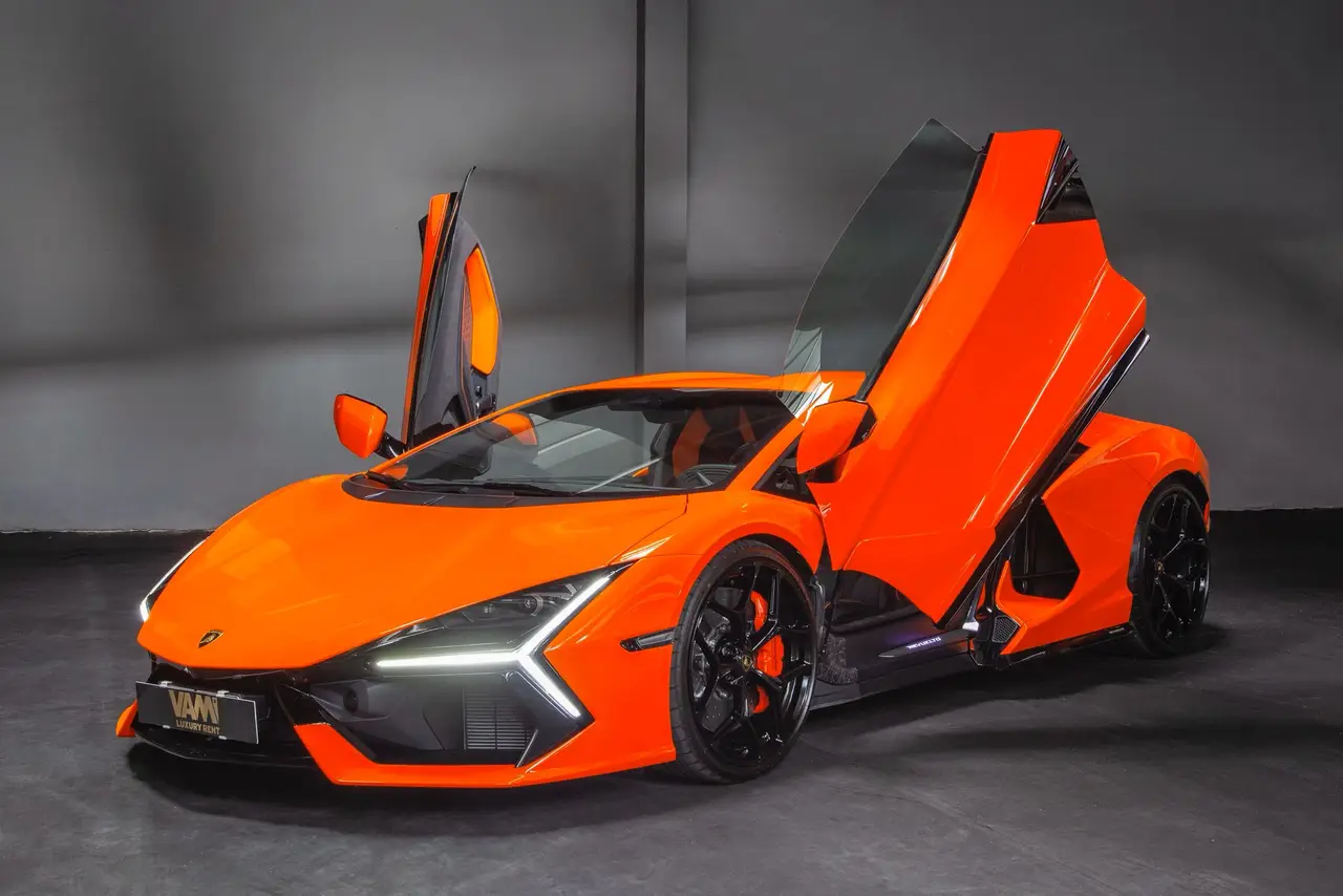 Lamborghini Revuelto 2026, side profile — Lisbon Luxury Car Rental, Lisbon. The Revuelto is Lamborghini's first series-production V12 hybrid, and it drives like an…