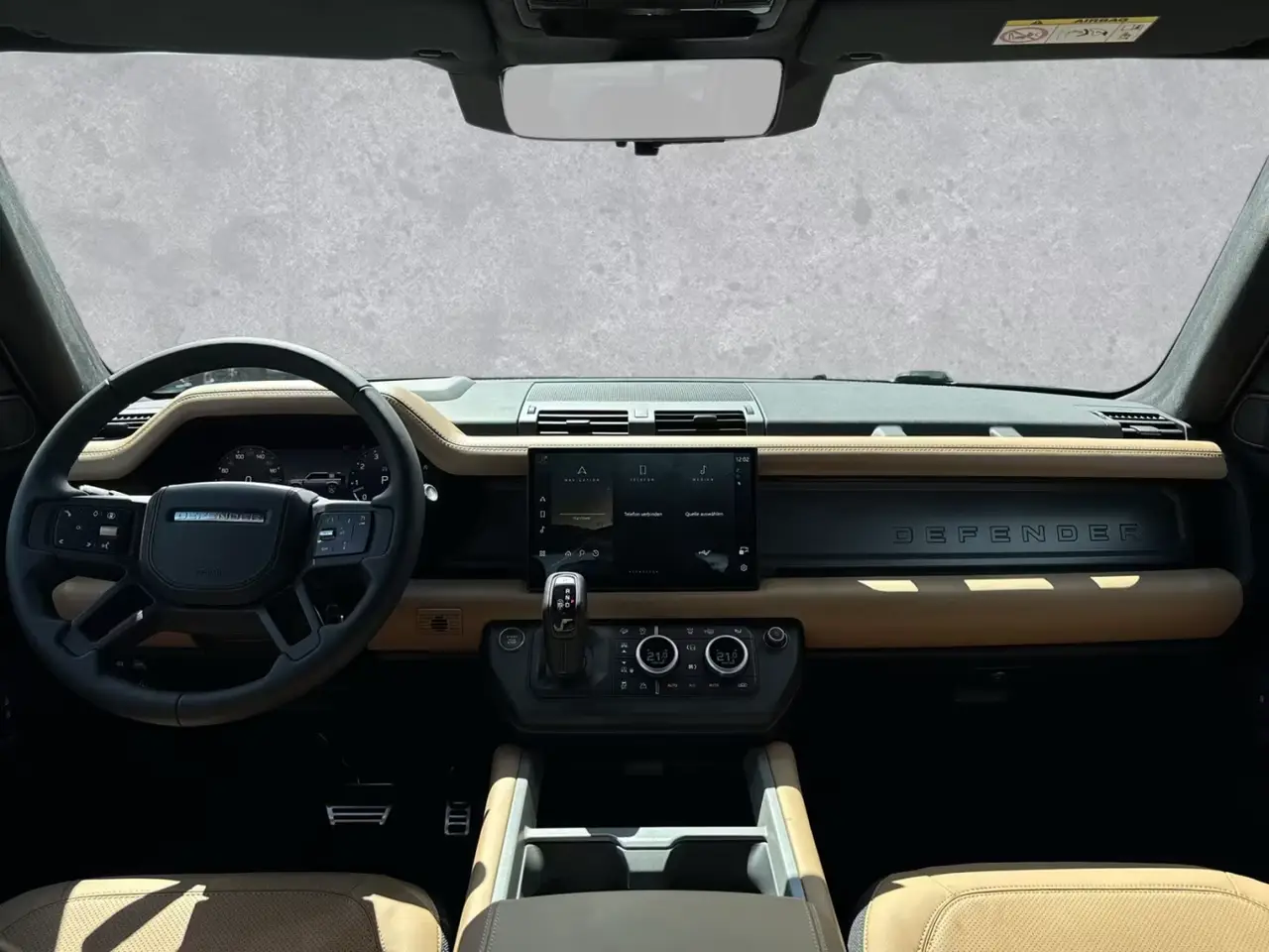 Land Rover Defender 2024, rear view — Lisbon Luxury Car Rental, Lisbon. The 2024 Land Rover Defender brings 400 hp and seven seats to a fleet mostly built around…