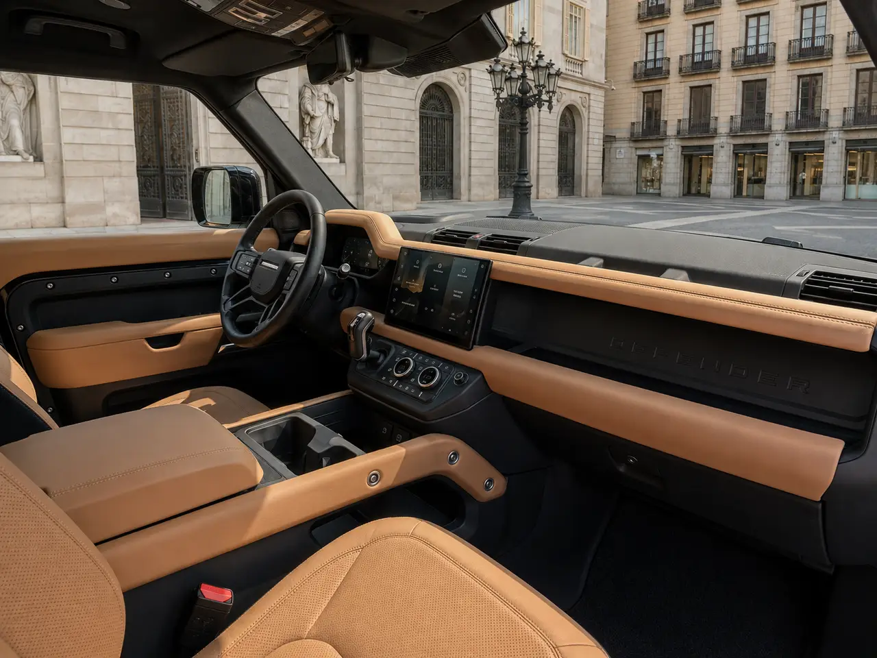 Land Rover Defender 2024, interior — Lisbon Luxury Car Rental, Lisbon. The 2024 Land Rover Defender brings 400 hp and seven seats to a fleet mostly built around…
