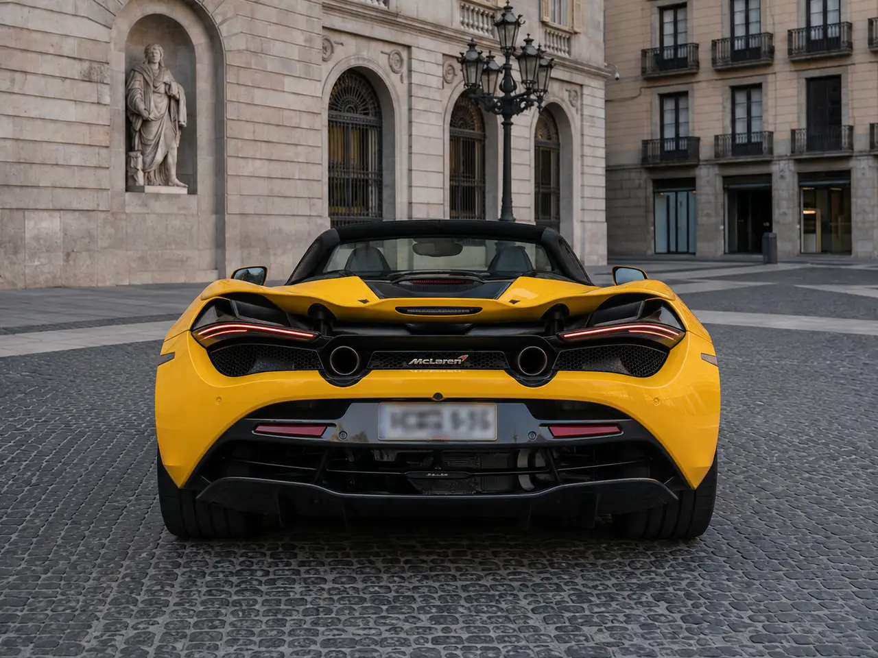 McLaren 720S Spider 2022, rear view — Lisbon Luxury Car Rental, Lisbon. The 2022 McLaren 720S Spider carries 720 hp through a mid-engine layout built for…