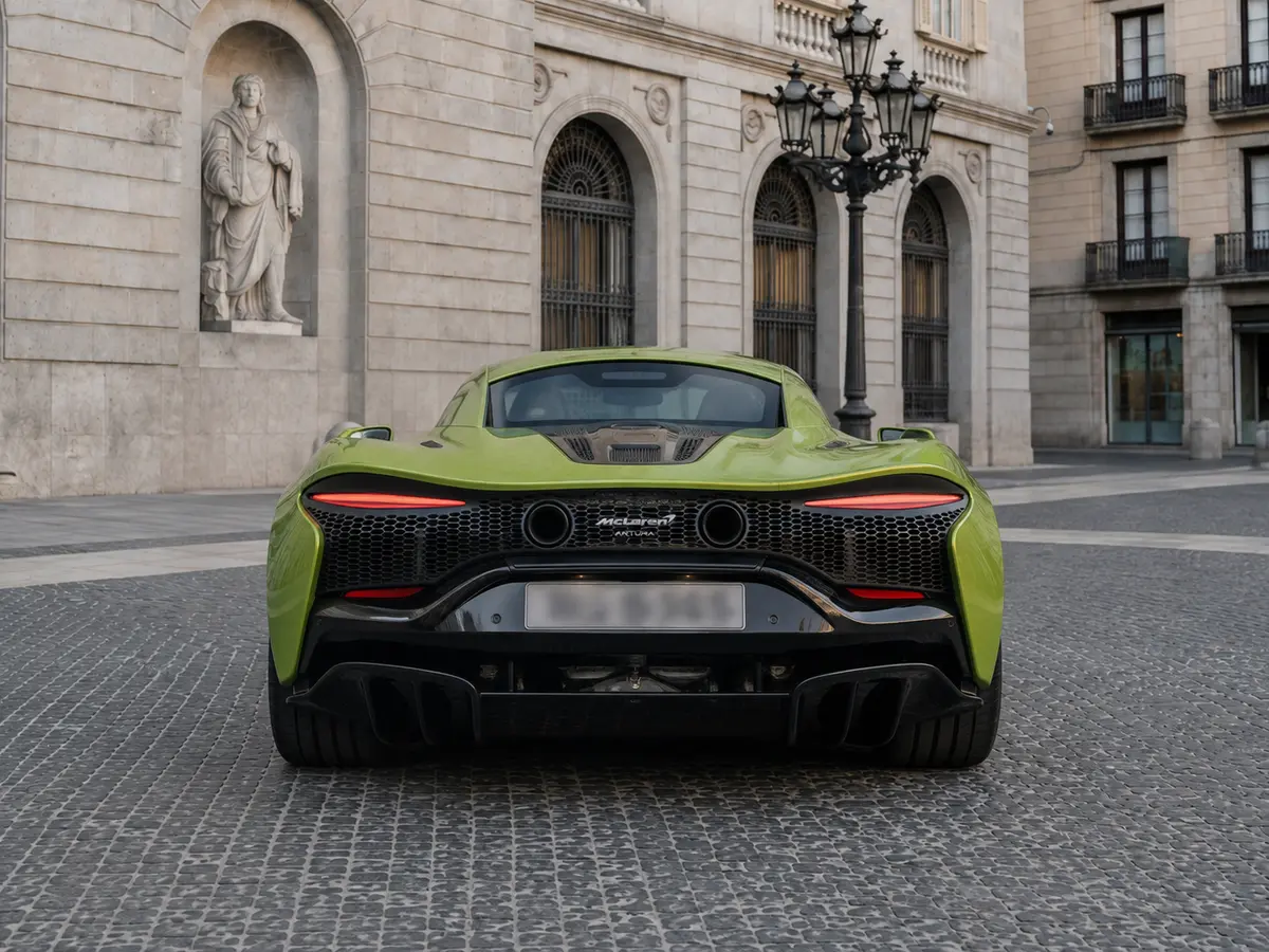 McLaren Artura Spider 2024, rear view — Lisbon Luxury Car Rental, Lisbon. The 2024 McLaren Artura Spider carries a plug-in hybrid V6 producing 671 hp, delivered…