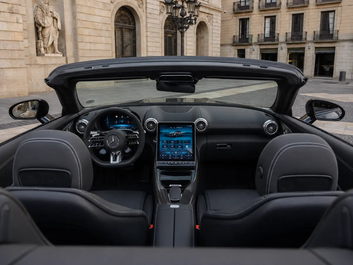 Mercedes Benz SL63 Cabrio 2023, interior — Lisbon Luxury Car Rental, Lisbon. The Mercedes Benz SL63 Cabrio pairs a 585 hp V8 with the folding roof and four-seat cabin…