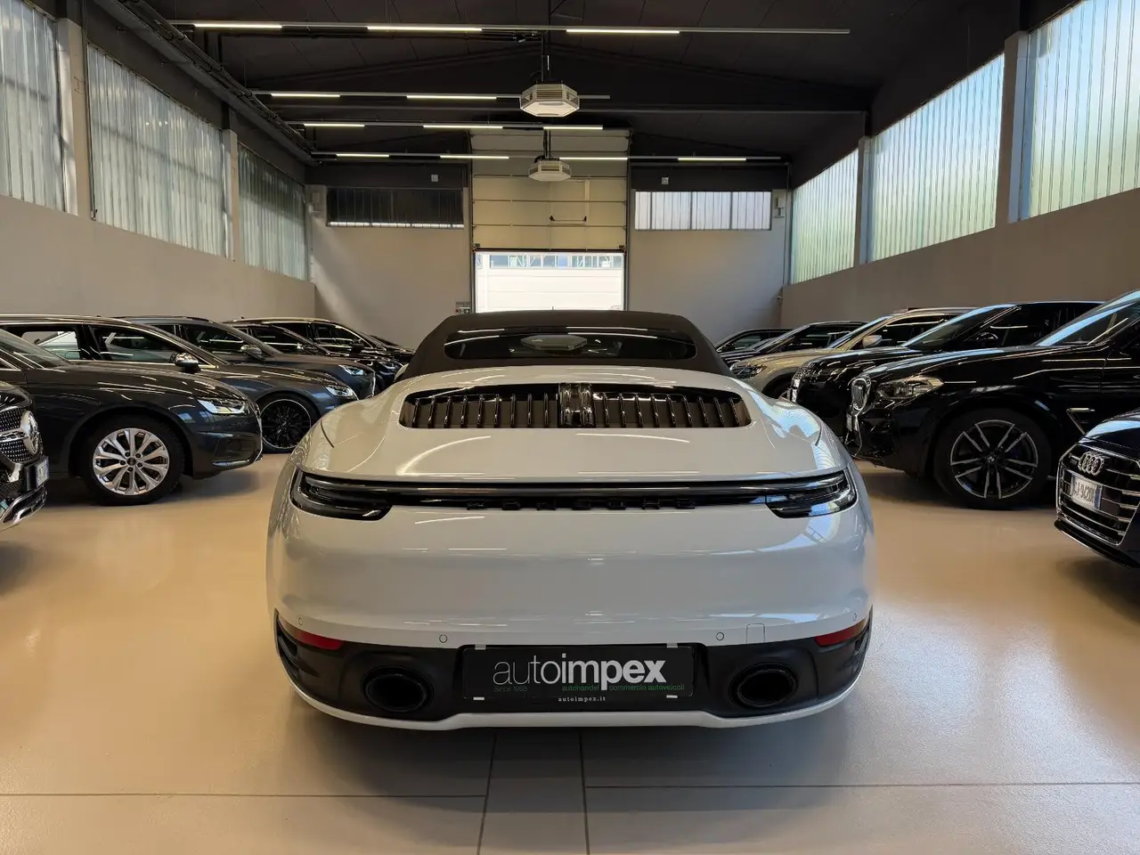 Porsche 911 Carrera S Cabrio (992) 2025, exterior — Lisbon Luxury Car Rental, Lisbon. The 2025 Porsche 911 Carrera S Cabrio (992) carries 480 hp with the composure Porsche's…