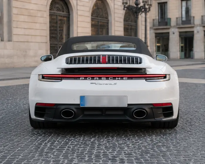 Porsche 911 Carrera S Cabrio (992) 2025, rear view — Lisbon Luxury Car Rental, Lisbon. The 2025 Porsche 911 Carrera S Cabrio (992) carries 480 hp with the composure Porsche's…