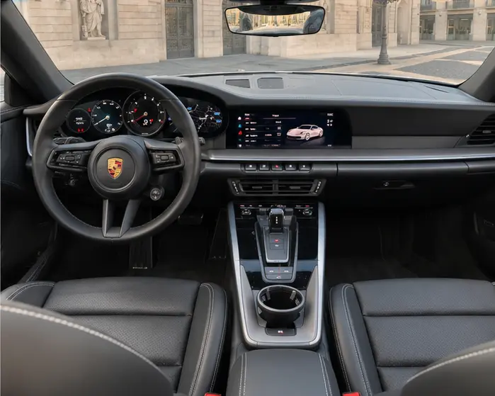 Porsche 911 Carrera S Cabrio (992) 2025, interior — Lisbon Luxury Car Rental, Lisbon. The 2025 Porsche 911 Carrera S Cabrio (992) carries 480 hp with the composure Porsche's…