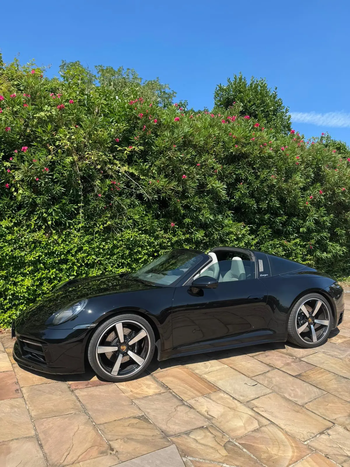 Porsche 911 Targa 2025, rear view — Lisbon Luxury Car Rental, Lisbon. The 2025 Porsche 911 Targa pairs the 911's low, deliberate stance with a retractable roof…
