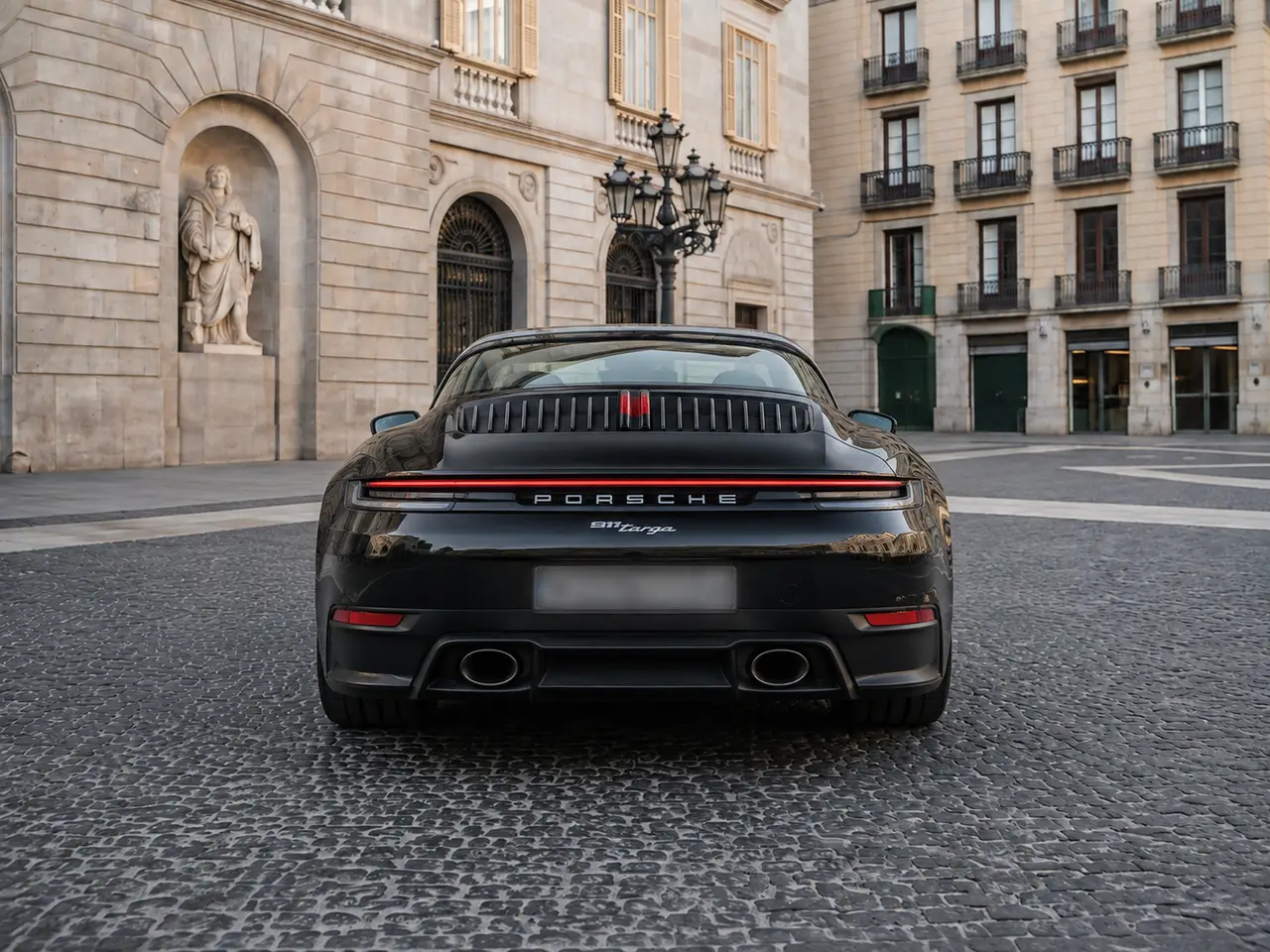 Porsche 911 Targa 2025, rear view — Lisbon Luxury Car Rental, Lisbon. The 2025 Porsche 911 Targa pairs the 911's low, deliberate stance with a retractable roof…