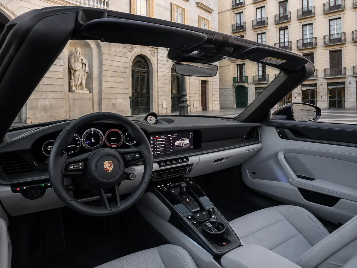 Porsche 911 Targa 2025, interior — Lisbon Luxury Car Rental, Lisbon. The 2025 Porsche 911 Targa pairs the 911's low, deliberate stance with a retractable roof…