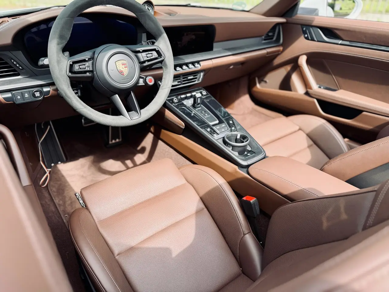 Porsche 992.2 Carrera 4 GTS Cabrio 2025, dashboard — Lisbon Luxury Car Rental, Lisbon. The 2025 Porsche 992.2 Carrera 4 GTS Cabrio carries 540 hp through all four wheels, and…