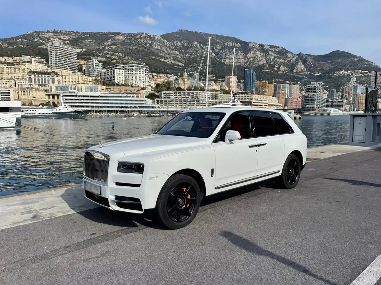 Rolls-Royce Cullinan 2022, rear view — Lisbon Luxury Car Rental, Lisbon. The Rolls-Royce Cullinan carries its size without any sense of effort. With 563 hp under…