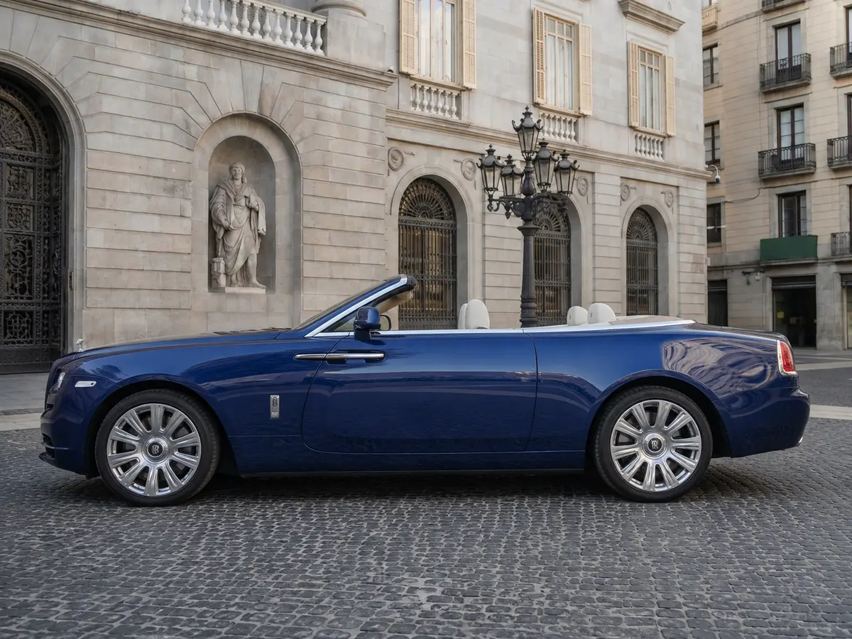 Rolls-Royce Dawn 2022, exterior — Lisbon Luxury Car Rental, Lisbon. The Rolls-Royce Dawn carries its 563 hp with the kind of composure that never announces…