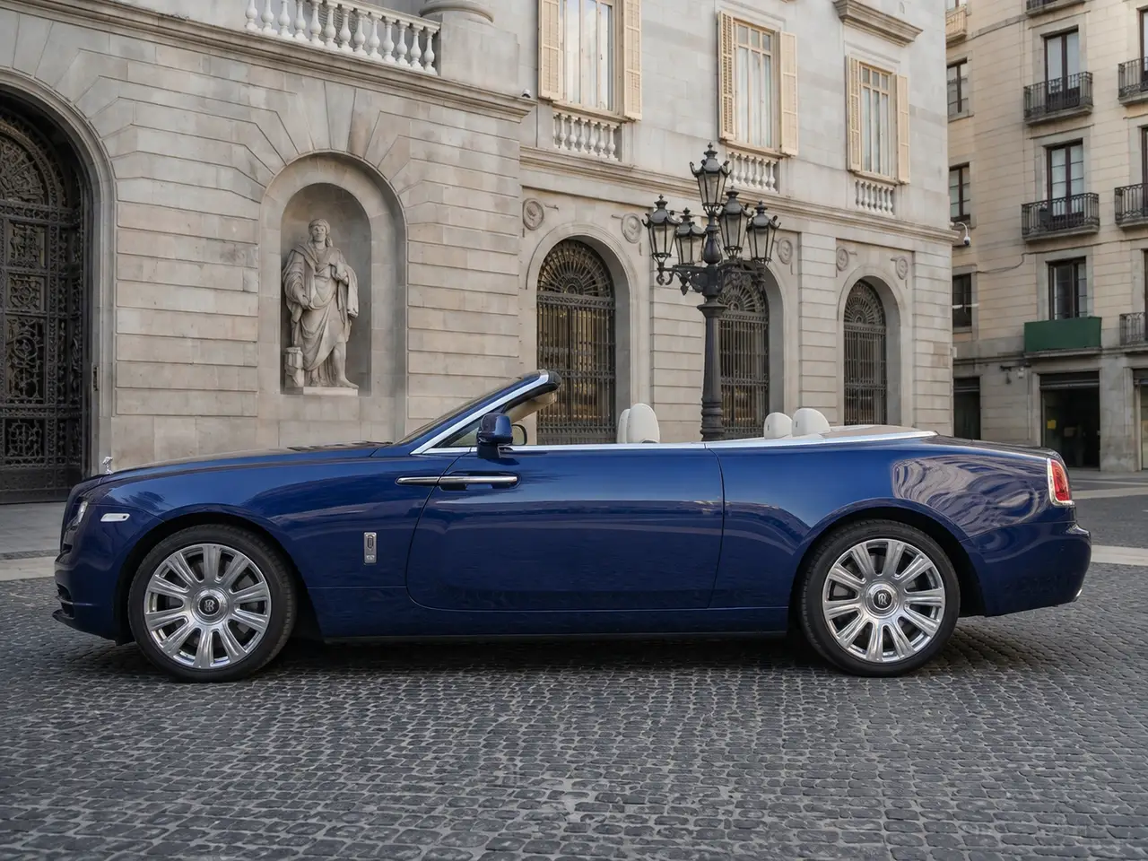 Rolls-Royce Dawn 2022, exterior — Lisbon Luxury Car Rental, Lisbon. The Rolls-Royce Dawn carries its 563 hp with the kind of composure that never announces…