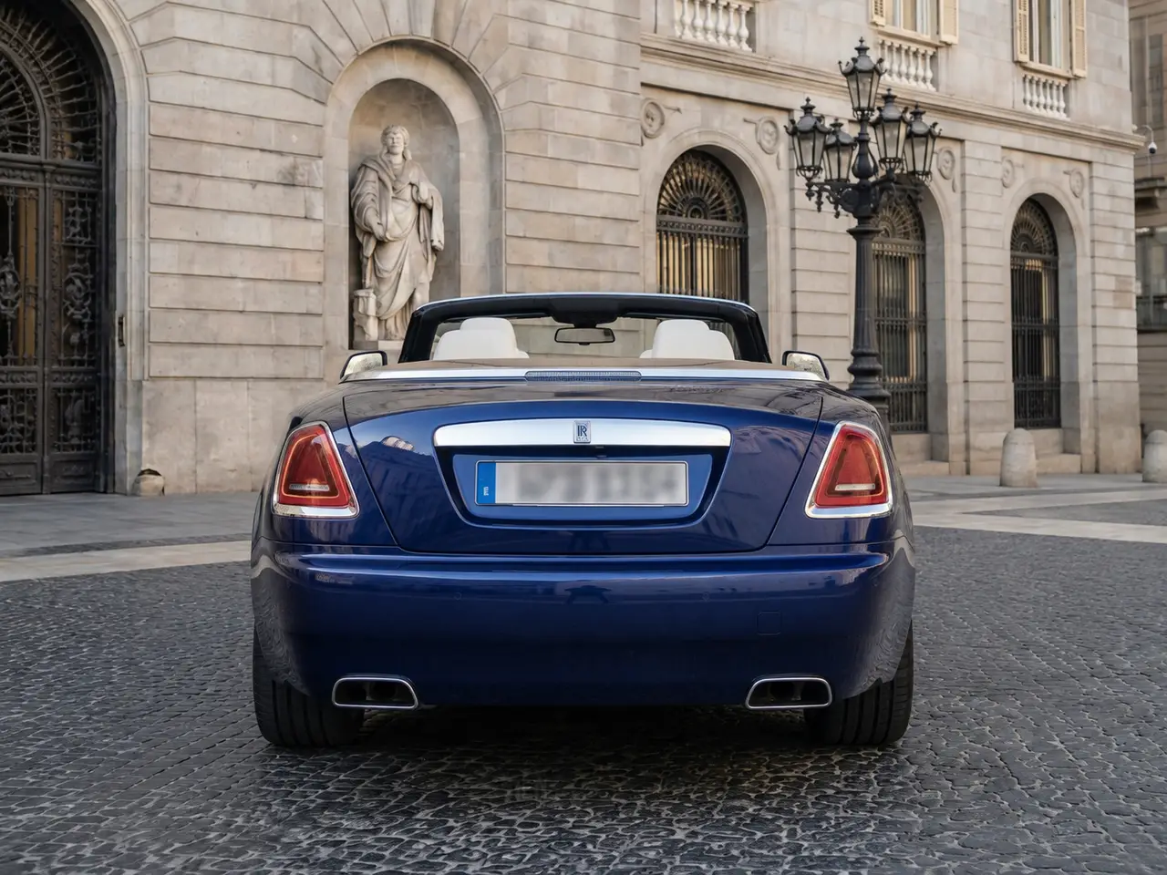 Rolls-Royce Dawn 2022, rear view — Lisbon Luxury Car Rental, Lisbon. The Rolls-Royce Dawn carries its 563 hp with the kind of composure that never announces…