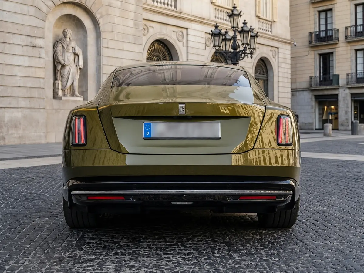 Rolls-Royce Spectre 2024, rear view — Lisbon Luxury Car Rental, Lisbon. The Rolls-Royce Spectre is Rolls-Royce's first series-production electric model, and it…